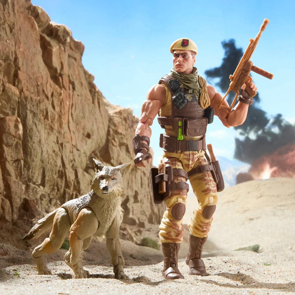Classified Series Dusty in desert camo standing beside Sandstorm the coyote in a canyon diorama