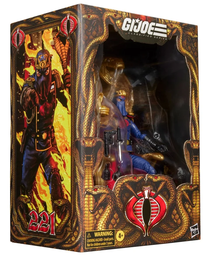The retail box for Classified Series Cobra Commander, a window box in gold and black with coiled cobras down both sides, the number 221 printed large in red on the side panel beneath comic art of Cobra Commander against a wall of flame, the figure visible through the window with the throne behind it