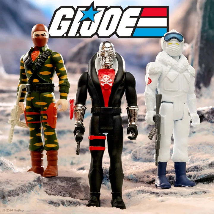 Three carded Super7 ReAction Wave 8 figures posed on a snowy rock diorama under the G.I. Joe logo: Sabre Tooth in green and yellow tiger camouflage with a white rifle, Red Jackal in black with a chrome skull face, and a white Snow Serpent holding a grey rifle