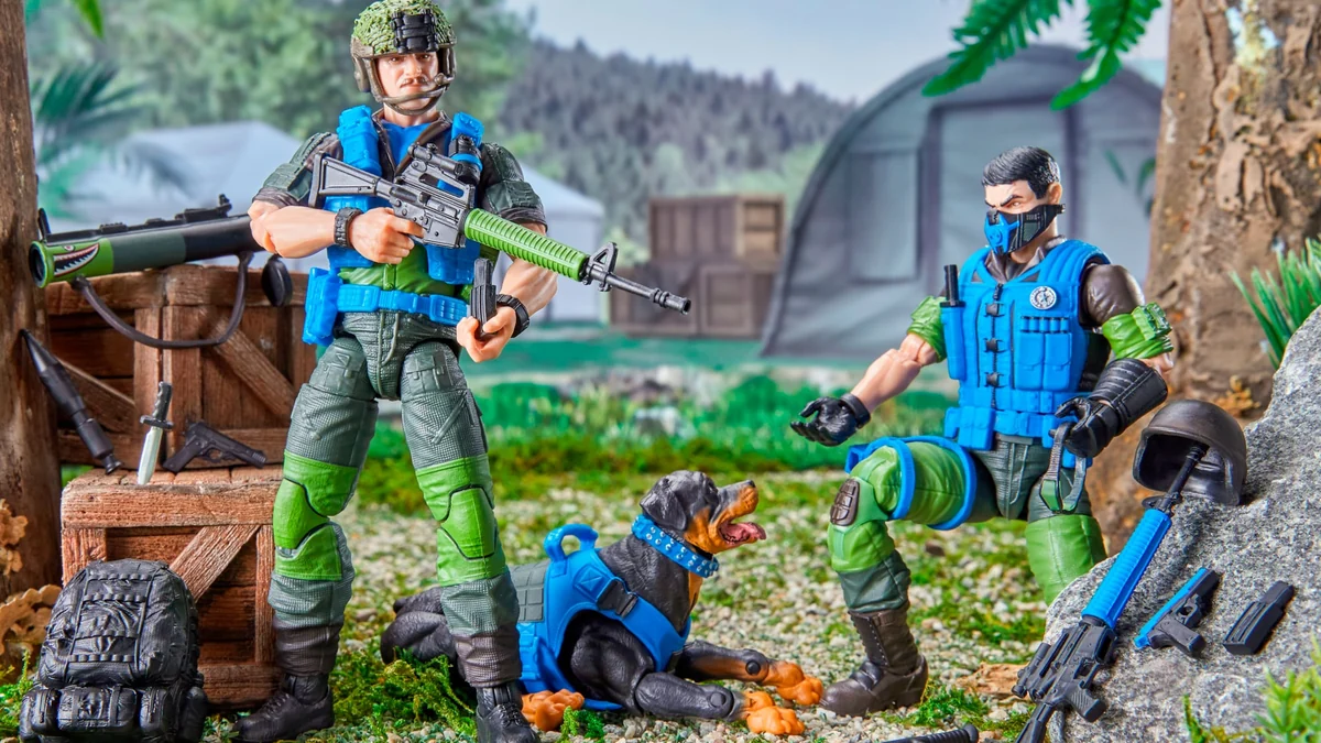 Footloose, Mutt and Junkyard posed in a jungle diorama with a G.I. Joe field camp behind them