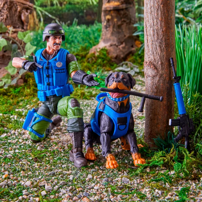 Mutt crouched low on jungle ground with Junkyard standing beside him